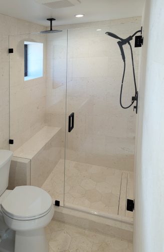 Inline Glass Shower Doors with Matte Black Hardware and Notched Panel