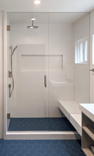Inline Glass Shower Doors with Brushed Bronze Hardware and Low Iron Glass